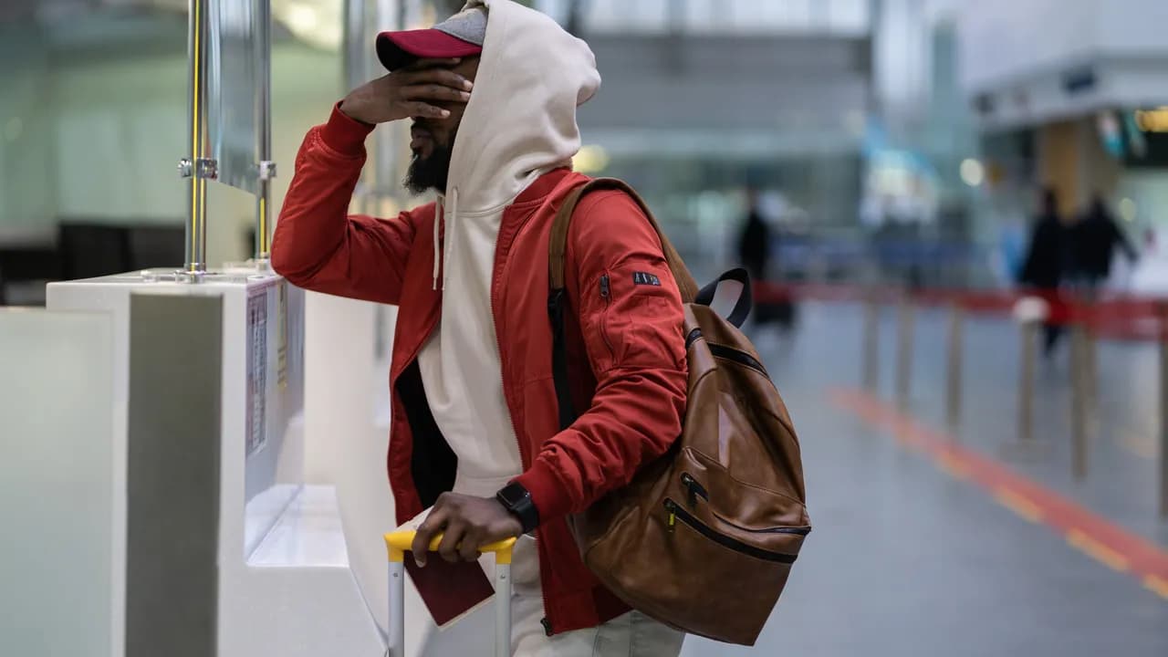 photologuephotos2022-12frustrated-disappointed-african-american-male-passenger-with-luggage-overslept-and-missed-flightjpg photologuephotos2022-12frustrated-disappointed-african-american-male-passenger-with-luggage-overslept-and-missed-flightjpg